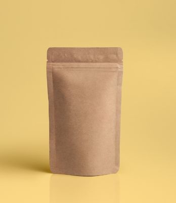 Filling stand up pouches by hand at home a blank, brown stand up pouch