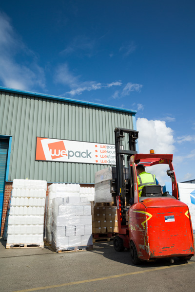 What is Pick and Pack Order Fulfilment? A man in a forklift in front of an order of products